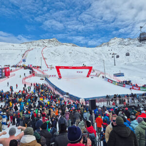 Exciting World Cup race in Gurgl gets season off to a feelgood start Crowd of spectators watching a slalom ski race on a snow-covered mountain with cable cars overhead.
