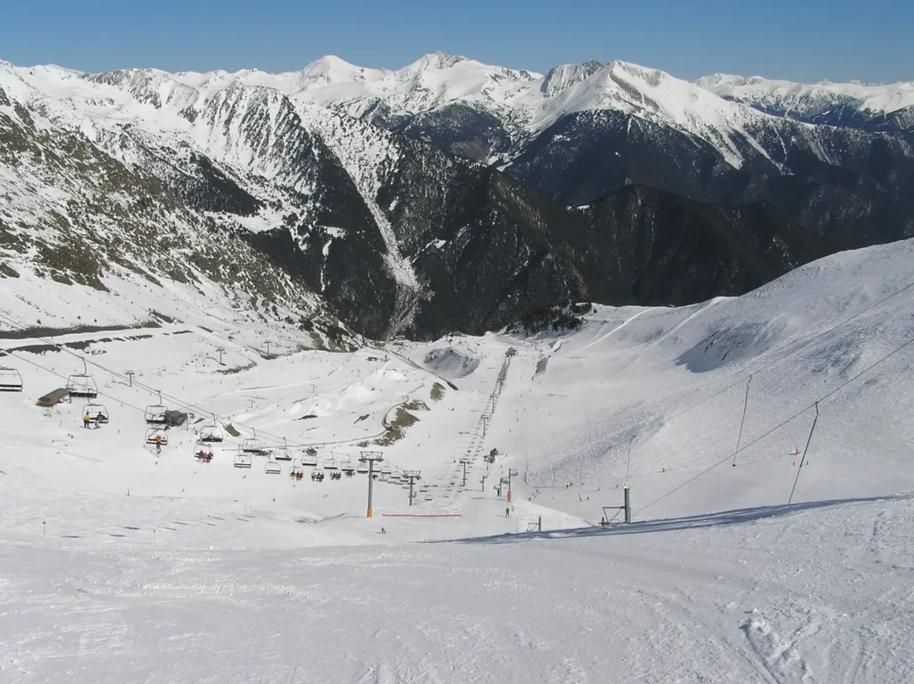 View from the top of the Arinsal ski area in Andorra, looking down the snow-covered valley