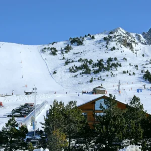 Small Country, Big Mountains: Why Andorra Deserves a Place on Your Ski List Skiers on a wide sunlit piste at Pas de la Casa in the Grandvalira ski area, Andorra